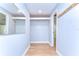 Hallway view with wood floors and closet with storage at 1120 Country Ln, Lutz, FL 33558