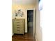 Bedroom with a chest of drawers and an open closet door to reveal closet space at 120 S Church Ave # 207, Tampa, FL 33609