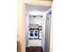 Kitchen with white cabinets, granite countertops, stainless steel sink and white appliances at 120 S Church Ave # 207, Tampa, FL 33609