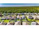 A charming home with a well-maintained lawn in a vibrant community surrounded by lush greenery at 12123 Ledbury Commons Dr, Gibsonton, FL 33534