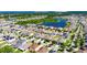 Aerial view of a residential area with a lake, with the property marked by a red pin at 12123 Ledbury Commons Dr, Gibsonton, FL 33534