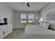 Cozy bedroom features wood-look floors, a ceiling fan and lots of natural light at 12123 Ledbury Commons Dr, Gibsonton, FL 33534