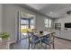Dining area with sliding glass doors to the patio, seamlessly blending indoor and outdoor living at 12123 Ledbury Commons Dr, Gibsonton, FL 33534