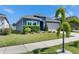Charming single-story home with a well-manicured lawn, lush landscaping, and a welcoming curb appeal at 12123 Ledbury Commons Dr, Gibsonton, FL 33534