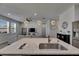 Bright, open kitchen featuring a granite countertop island with modern lighting and stainless steel appliances at 12123 Ledbury Commons Dr, Gibsonton, FL 33534