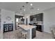 Modern kitchen with stainless steel appliances, a large island, and pendant lighting at 12123 Ledbury Commons Dr, Gibsonton, FL 33534