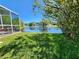 Lush backyard with a relaxing view of a lake at 13400 Old Florida Cir, Hudson, FL 34669