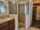 Beautiful bathroom features a glass shower, stylish sink, and wood vanity at 13400 Old Florida Cir, Hudson, FL 34669