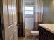Contemporary bathroom with a stylish vanity, tub, and soothing color scheme, designed for a relaxing and refreshing experience at 13400 Old Florida Cir, Hudson, FL 34669