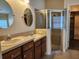 Beautiful bathroom features a glass shower, stylish sink, and wood vanity at 13400 Old Florida Cir, Hudson, FL 34669