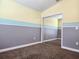 Charming bedroom with a color-block wall design, mirror closet, and a cozy feel perfect for or guests at 13400 Old Florida Cir, Hudson, FL 34669