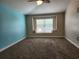 Relax in this bedroom featuring a fan and window seat at 13400 Old Florida Cir, Hudson, FL 34669