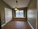 Bright dining area featuring tile floors, a window seat, and pantry, perfect for Gathering meals at 13400 Old Florida Cir, Hudson, FL 34669