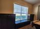 Cozy game room featuring a window bench, and custom dark wood cabinetry at 13400 Old Florida Cir, Hudson, FL 34669