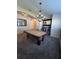 Spacious game room includes a pool table, a stylish chandelier, and a bar area at 13400 Old Florida Cir, Hudson, FL 34669