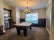 Entertain in style in this game room featuring a pool table and custom window bench at 13400 Old Florida Cir, Hudson, FL 34669