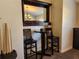 Charming game room features a pub-style bar table, cue rack, and storage at 13400 Old Florida Cir, Hudson, FL 34669