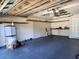 Spacious garage with a painted floor, shelving, and an electric garage door opener at 13400 Old Florida Cir, Hudson, FL 34669