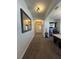 Spacious hallway with elegant mirror offers an inviting entrance to the home at 13400 Old Florida Cir, Hudson, FL 34669