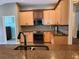 An open kitchen with stainless steel appliances and granite countertops at 13400 Old Florida Cir, Hudson, FL 34669