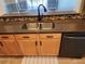 The kitchen features a stainless steel sink, black faucet, and granite countertops at 13400 Old Florida Cir, Hudson, FL 34669