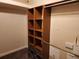 Spacious walk-in closet featuring custom shelves and hanging rods, offering ideal storage and organization solutions at 13400 Old Florida Cir, Hudson, FL 34669