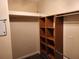 Spacious walk-in closet with built-in shelving and ample storage space to efficiently organize your wardrobe and personal items at 13400 Old Florida Cir, Hudson, FL 34669