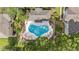 Aerial view of community pool featuring trees and lush landscaping at 14936 Salamander Pl, Tampa, FL 33625