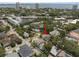An aerial view of the city and a charming neighborhood featuring mature trees and a lovely home at 1603 S Arrawana Ave, Tampa, FL 33629