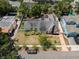 Aerial view of a well-maintained home featuring a manicured lawn and classic architecture at 1603 S Arrawana Ave, Tampa, FL 33629