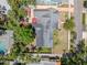 An aerial view of a well-kept home with a dark gray roof and mature landscaping at 1603 S Arrawana Ave, Tampa, FL 33629