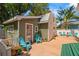 Lovely backyard featuring an outdoor seating area, lush greenery, and well-maintained landscaping at 1603 S Arrawana Ave, Tampa, FL 33629