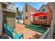 Spacious backyard featuring an outdoor dining set, comfortable seating, and mature trees at 1603 S Arrawana Ave, Tampa, FL 33629