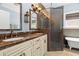 Bathroom with a double sink vanity, a glass shower, and a clawfoot tub at 1603 S Arrawana Ave, Tampa, FL 33629