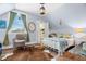 Cozy bedroom with sloped ceiling, a wicker chair, and a closet at 1603 S Arrawana Ave, Tampa, FL 33629