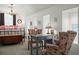 Bedroom featuring vaulted ceilings, a sitting area, and a view of the bed and outside windows at 1603 S Arrawana Ave, Tampa, FL 33629