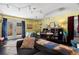 Bright bonus room with stylish decor, comfortable seating, and access to the outdoors at 1603 S Arrawana Ave, Tampa, FL 33629