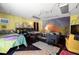 Bright, spacious bonus room with casual seating, a colorful rug, and unique decor at 1603 S Arrawana Ave, Tampa, FL 33629