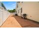 Spacious side yard featuring a patio, grill, and convenient access to the house at 1603 S Arrawana Ave, Tampa, FL 33629