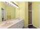 Bathroom with double sink vanity and tiled walk-in shower at 187 Sage Cir, Crystal Beach, FL 34681