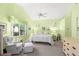 Bright bedroom features vaulted ceiling, ceiling fan, and large windows at 187 Sage Cir, Crystal Beach, FL 34681