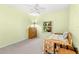 Cozy bedroom with neutral carpeting and a window offering natural light and an open view at 187 Sage Cir, Crystal Beach, FL 34681