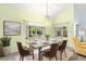 Dining room with neutral walls and a modern table setting creates an elegant dining space at 187 Sage Cir, Crystal Beach, FL 34681