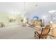 Bright living room features vaulted ceilings, neutral color scheme, and comfortable seating at 187 Sage Cir, Crystal Beach, FL 34681