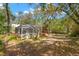 Relaxing screened-in pool and spa area nestled in a private yard with tropical foliage at 187 Sage Cir, Crystal Beach, FL 34681