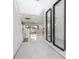 Bright foyer with high ceilings, marble floors, staircase, and a view into the living spaces at 19554 Roseate Dr, Lutz, FL 33558