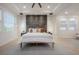 Serene bedroom featuring a plush bed and a decorative stone wall backdrop at 19554 Roseate Dr, Lutz, FL 33558