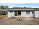 View of backyard featuring concrete patio and sliding glass door to the home at 1985 Hastings Dr, Clearwater, FL 33763