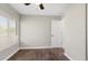 Bedroom with wood floors, natural light, and freshly painted walls at 1985 Hastings Dr, Clearwater, FL 33763