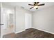 Empty bedroom includes a closet, window, and view to adjacent bathroom at 1985 Hastings Dr, Clearwater, FL 33763
